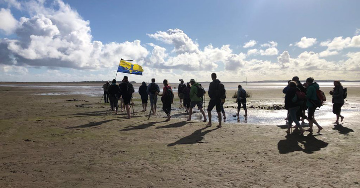 Pilgrims set off across the sands to Lindisfarne. 